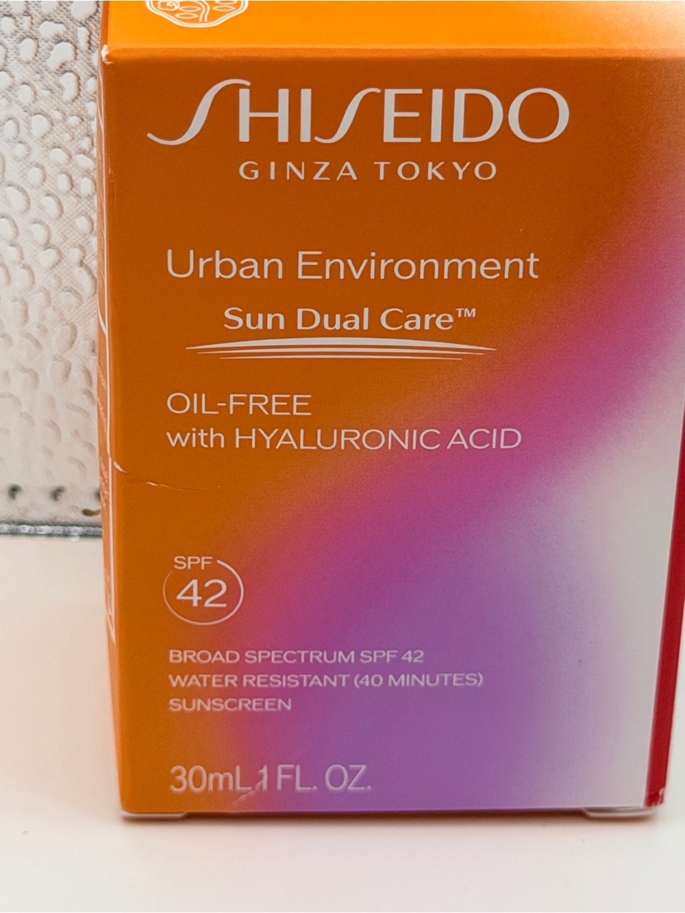 Shiseido Urban Environment Sun Dual Care SPF 42 - Orange and Pink Gradient
